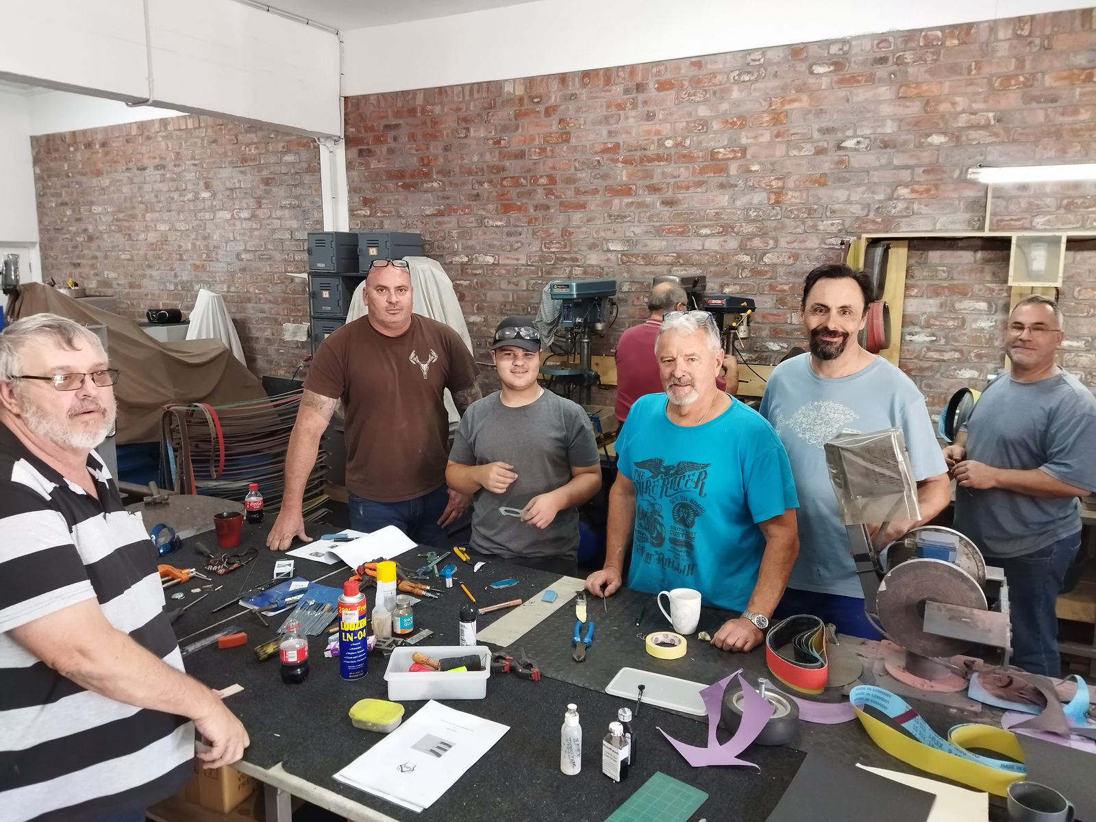 Fixed Blade Course in progress, students working at benches